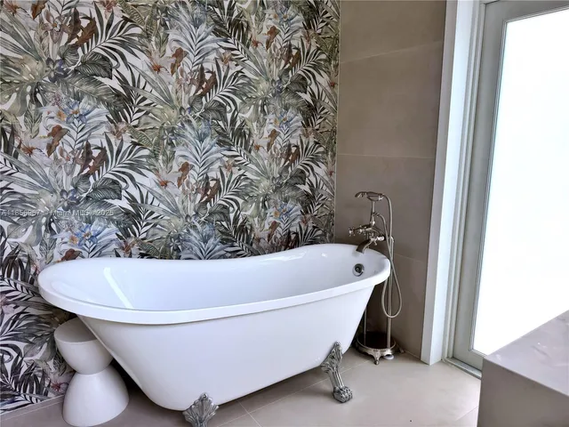a bath tub sitting in a bathroom