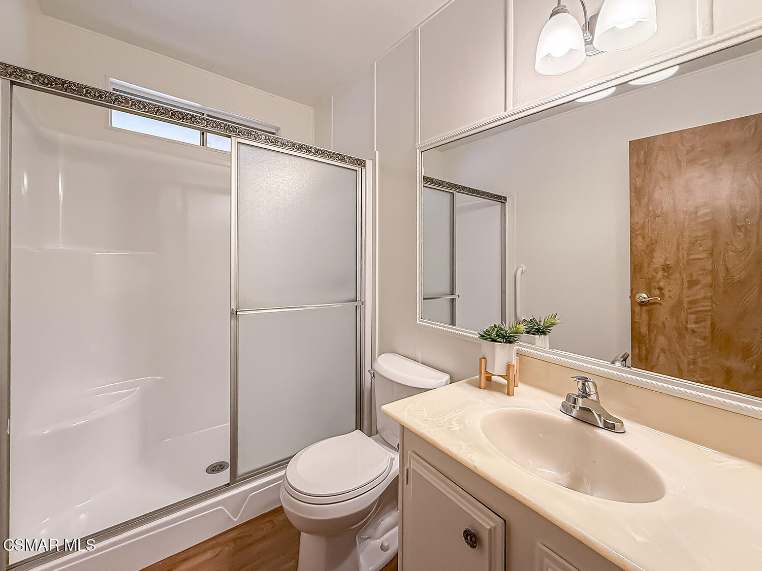 6480 Katherine Street, Unit 109 Simi Valley, CA 93063 - Photo 12 of 29 a bathroom with a sink toilet and shower