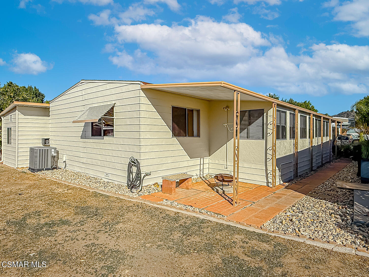 6480 Katherine Street, Unit 109 Simi Valley, CA 93063 - Photo 21 of 29 a view of a house with backyard