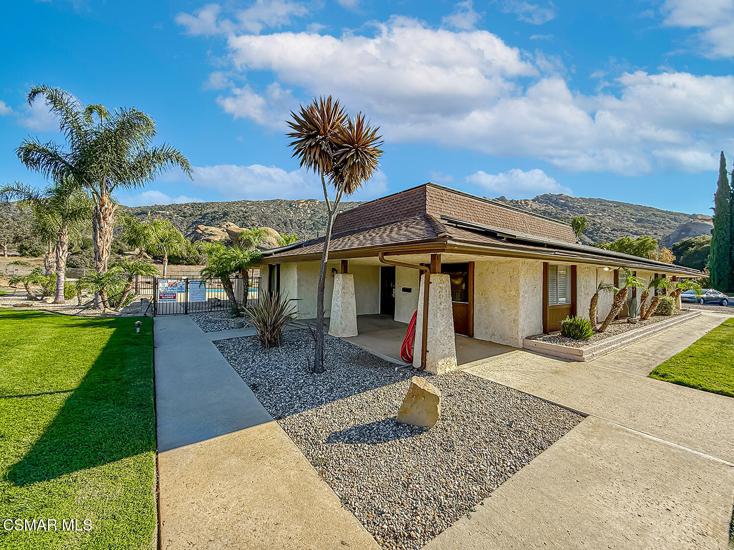6480 Katherine Street, Unit 109 Simi Valley, CA 93063 - Photo 24 of 29 a front view of a house with garden