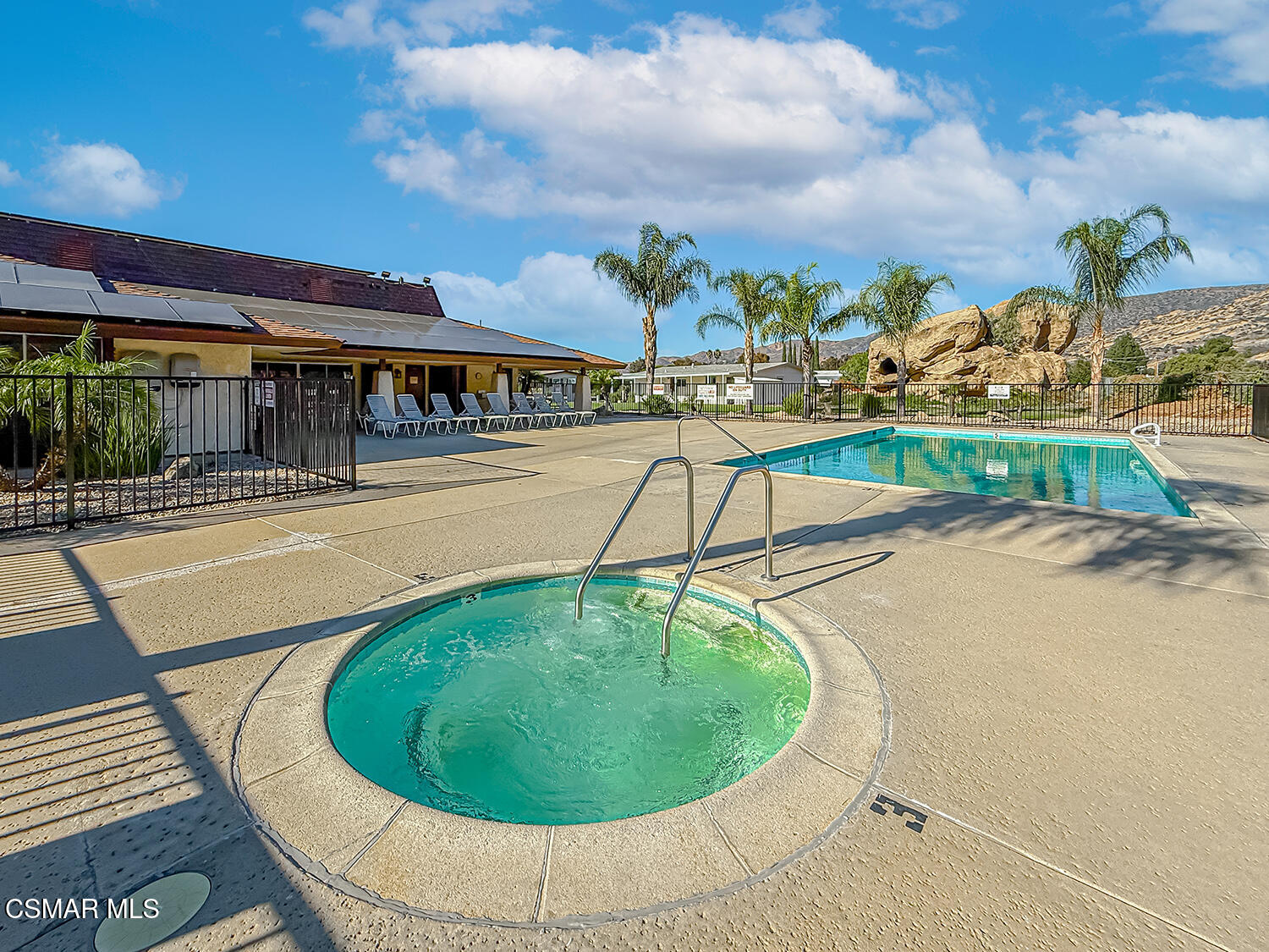 6480 Katherine Street, Unit 109 Simi Valley, CA 93063 - Photo 25 of 29 a view of a swimming pool with an outdoor seating