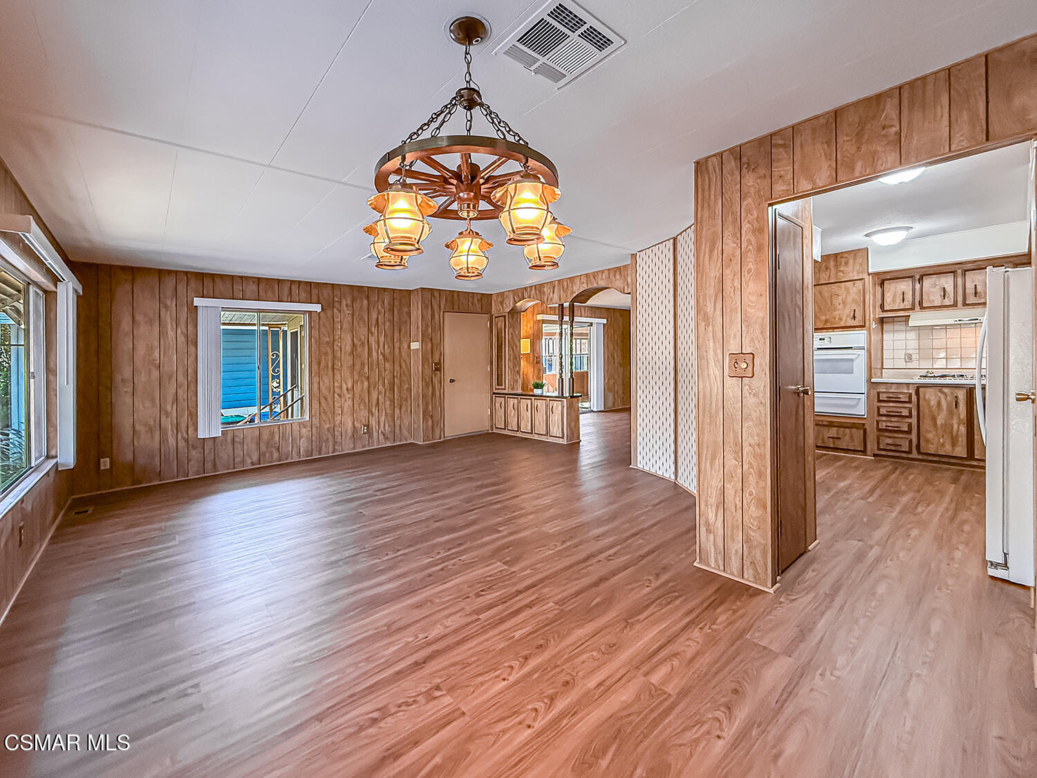 6480 Katherine Street, Unit 109 Simi Valley, CA 93063 - Photo 6 of 29 wooden floor in an empty room with a window