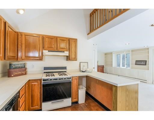 93 Shell Lane Barnstable, MA 02635 - Photo 8 of 27 a kitchen with stainless steel appliances granite countertop a stove a sink and a refrigerator