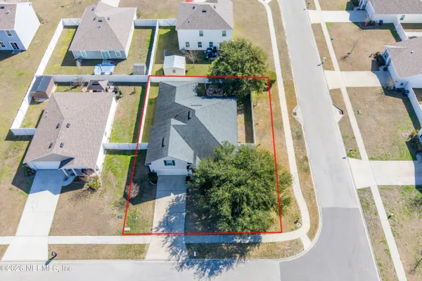 an aerial view of a house with swimming pool