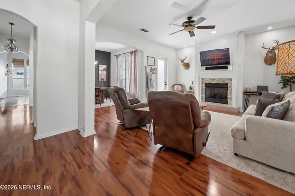 a living room with furniture and a fireplace