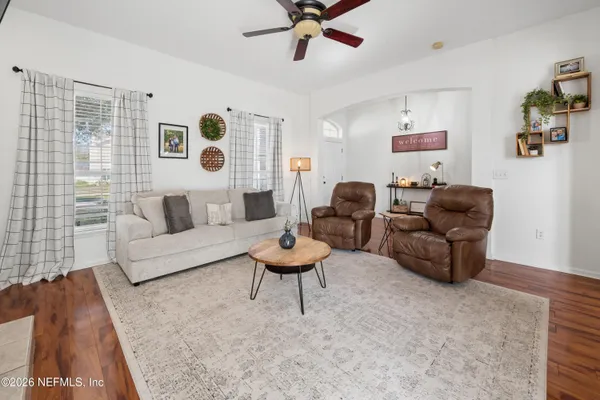 a living room with furniture and a large window