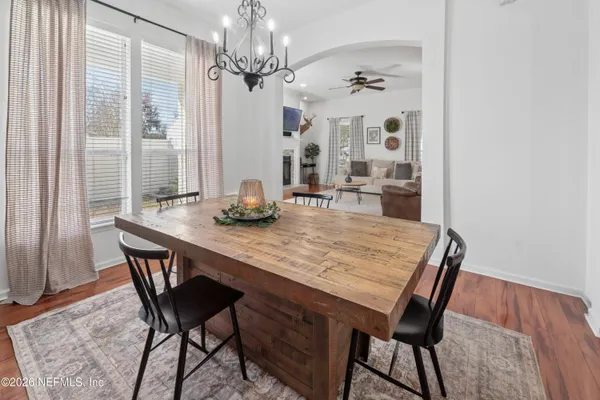 a dining room with a table and chairs