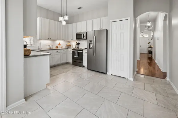 a view of a hallway with washer and dryer