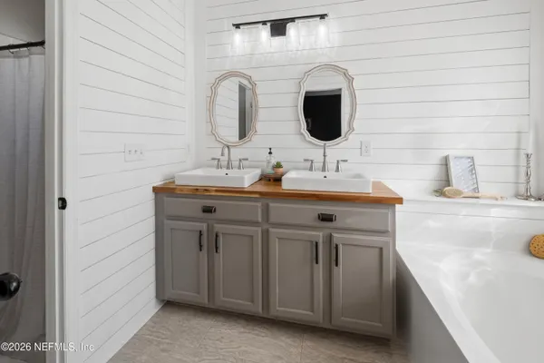 a bedroom with a bed and a tv