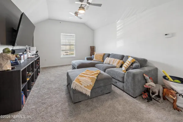 a bedroom with furniture and a chandelier