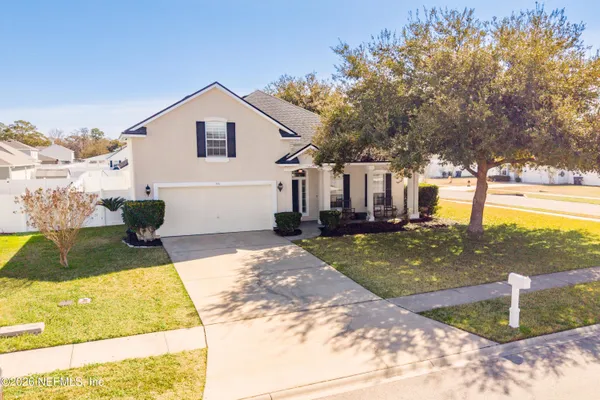 a view of a backyard of the house