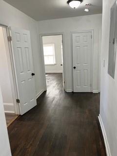 2158 Beecher Road Southwest, Unit A Atlanta, GA 30311 - Photo 11 of 21 an empty room with wooden floor and windows