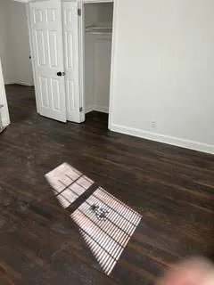 an empty room with wooden floor