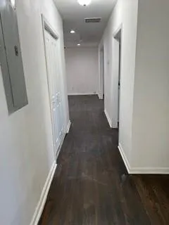 a kitchen with granite countertop a stove a sink and a microwave