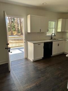 2158 Beecher Road Southwest, Unit A Atlanta, GA 30311 - Photo 20 of 21 a kitchen with granite countertop a stove a sink and a microwave