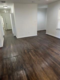 2158 Beecher Road Southwest, Unit A Atlanta, GA 30311 - Photo 5 of 21 an empty room with wooden floor and windows