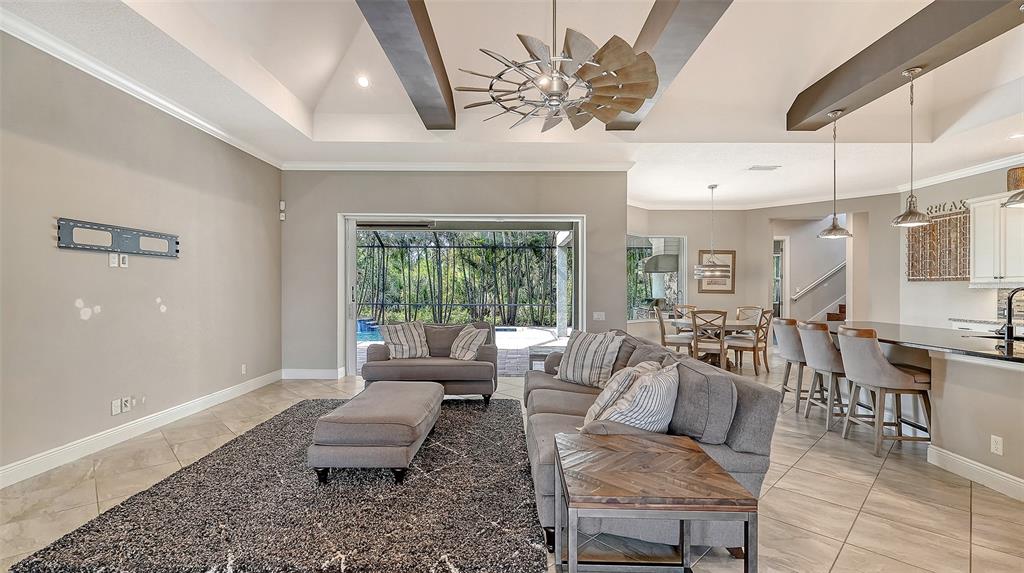 318 Ragdoll Run Bradenton, FL 34212 - Photo 14 of 87 a living room with furniture and a large window