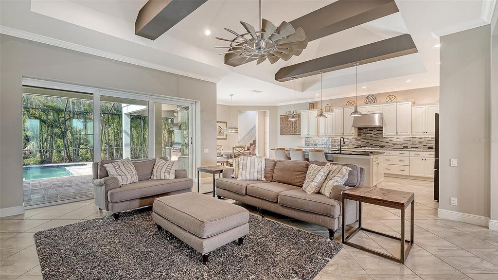 318 Ragdoll Run Bradenton, FL 34212 - Photo 15 of 87 a living room with furniture and a large window