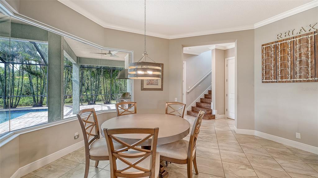 318 Ragdoll Run Bradenton, FL 34212 - Photo 22 of 87 a dining room with furniture and large windows