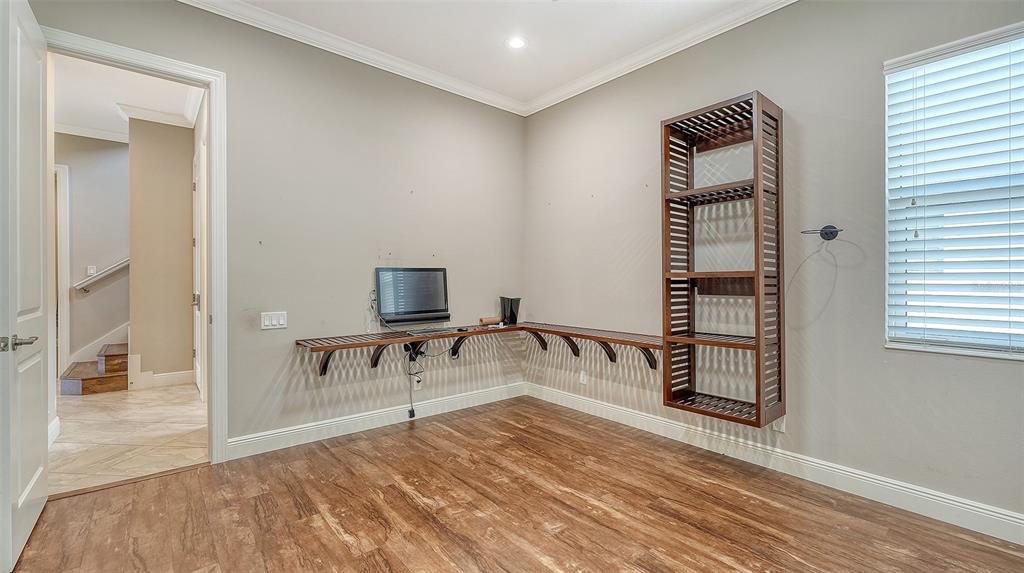 318 Ragdoll Run Bradenton, FL 34212 - Photo 36 of 87 a bedroom with a bed and a table in it