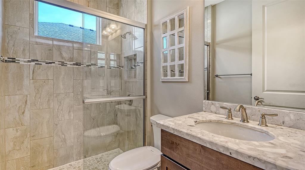 318 Ragdoll Run Bradenton, FL 34212 - Photo 37 of 87 a bathroom with a granite countertop sink toilet and shower