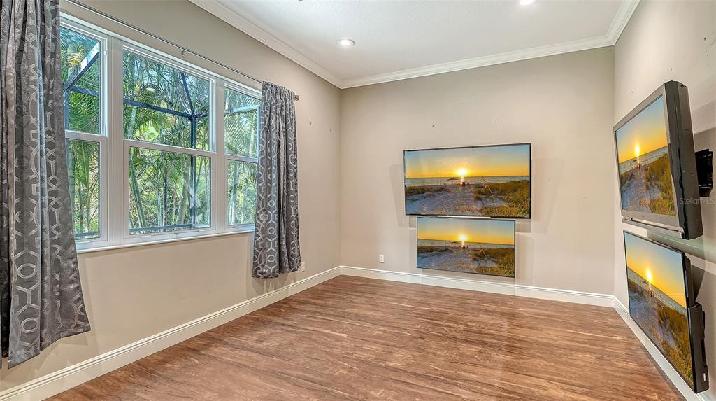318 Ragdoll Run Bradenton, FL 34212 - Photo 38 of 87 a view of an empty room with a window and wooden floor