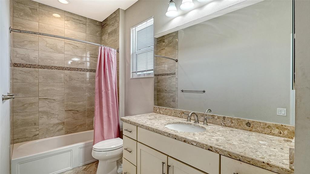 318 Ragdoll Run Bradenton, FL 34212 - Photo 47 of 87 a bathroom with a granite countertop sink toilet and shower