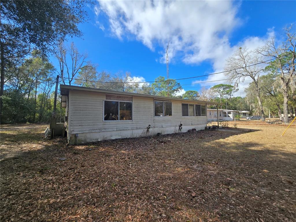 15640 Southwest 3rd Lane Ocala, FL 34481 - Photo 2 of 9 a view of a house with a yard