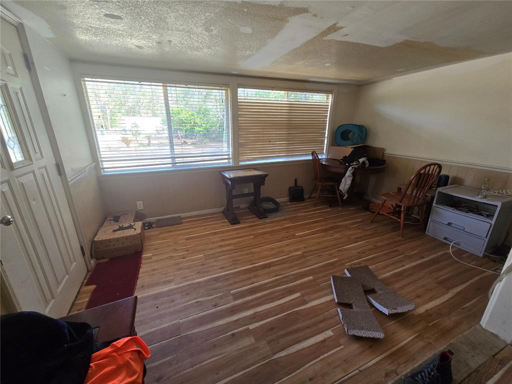 15640 Southwest 3rd Lane Ocala, FL 34481 - Photo 7 of 9 a bedroom with furniture and window