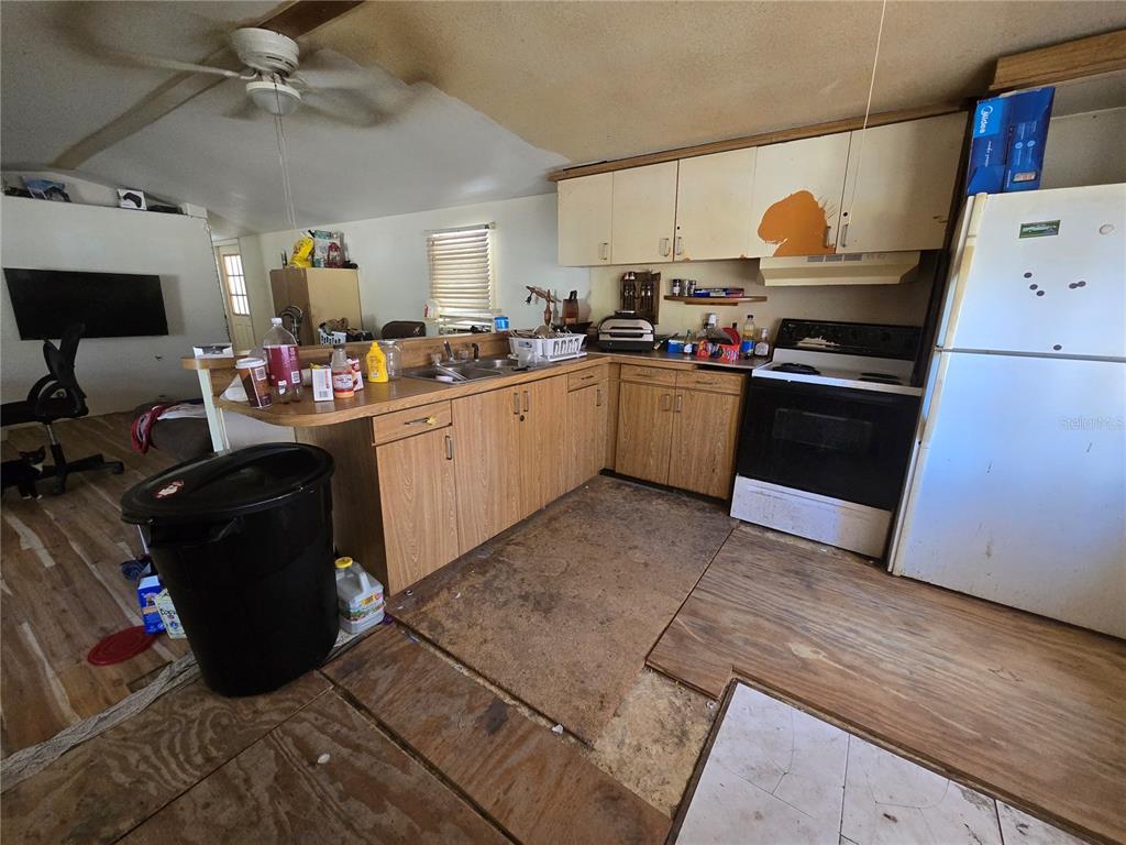 15640 Southwest 3rd Lane Ocala, FL 34481 - Photo 8 of 9 a kitchen with a sink cabinets and appliances