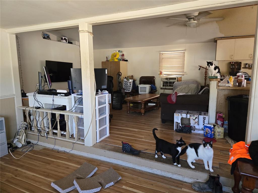 15640 Southwest 3rd Lane Ocala, FL 34481 - Photo 9 of 9 a living room with furniture and a flat screen tv