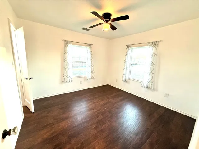 a bathroom with a toilet sink and shower