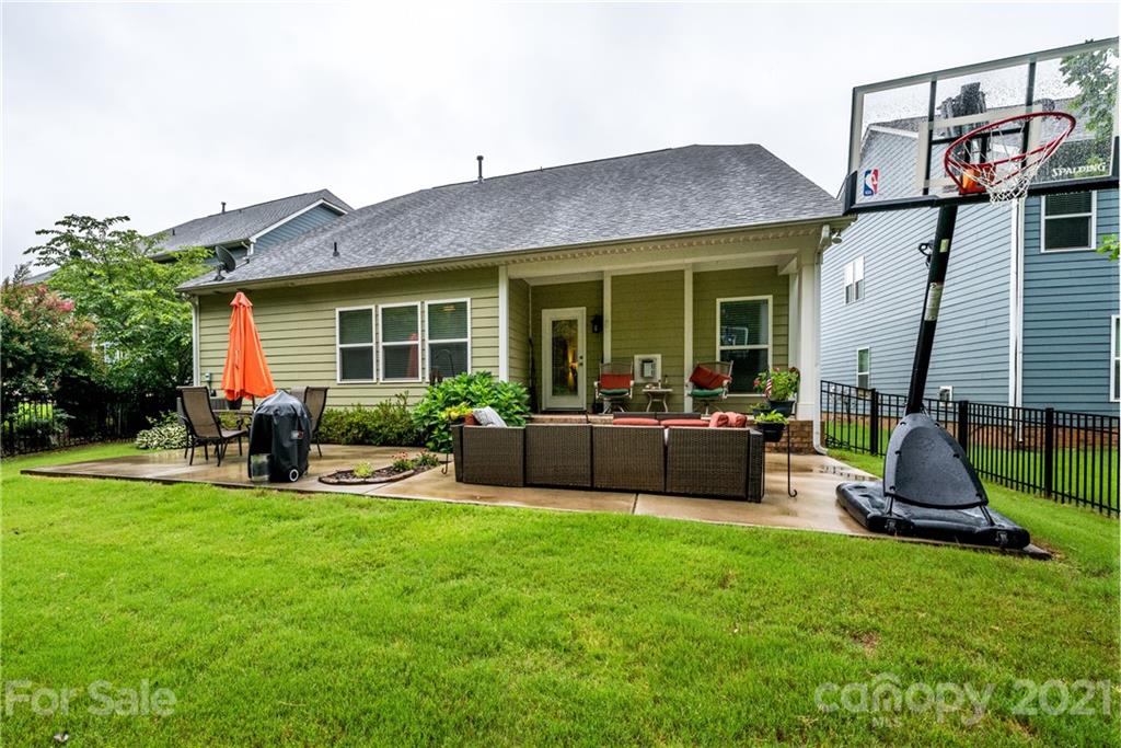 3028 Fallondale Road Waxhaw, NC 28173 - Photo 22 of 29 a view of a house with a backyard and a patio