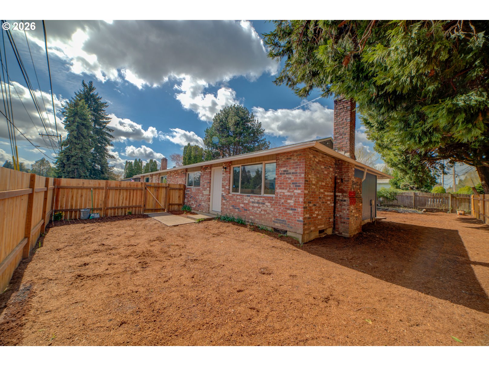 3825 Southwest 198th Avenue Beaverton, OR 97078 - Photo 3 of 23 a view of a backyard of the house