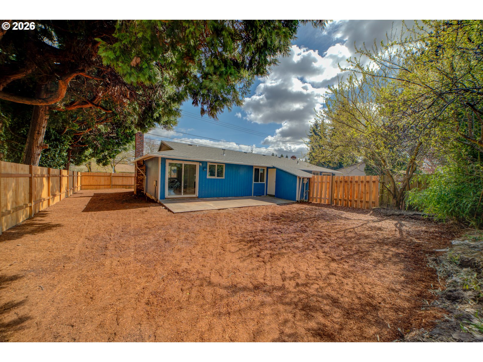 3825 Southwest 198th Avenue Beaverton, OR 97078 - Photo 4 of 23 a view of a house with a backyard and a tree