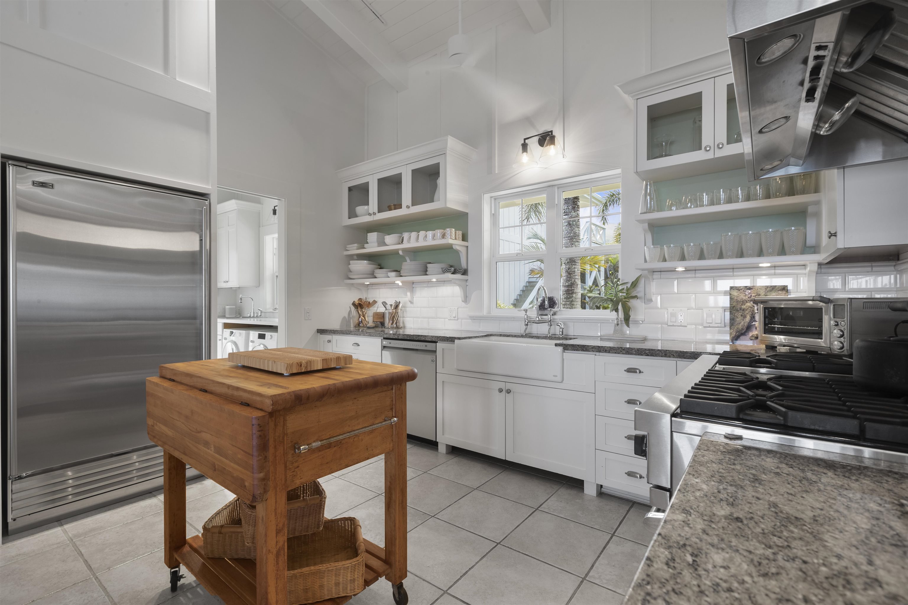 51 Kapohue Road Hana, HI 96713 - Photo 31 of 50 a kitchen with stainless steel appliances granite countertop a stove refrigerator sink and cabinets