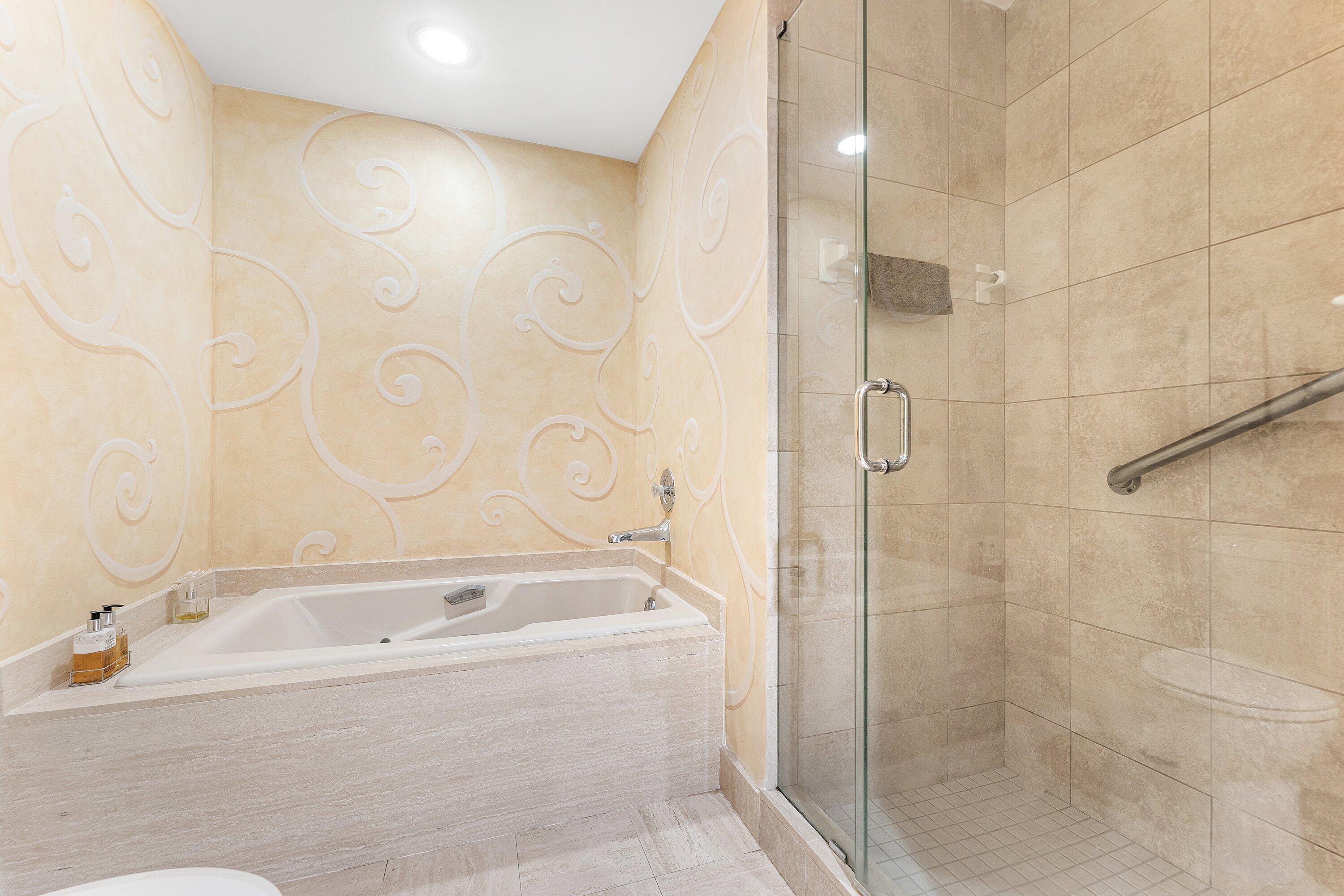 5 Eastgate Drive, Unit A Boynton Beach, FL 33436 - Photo 21 of 49 a bathroom with a bathtub and shower