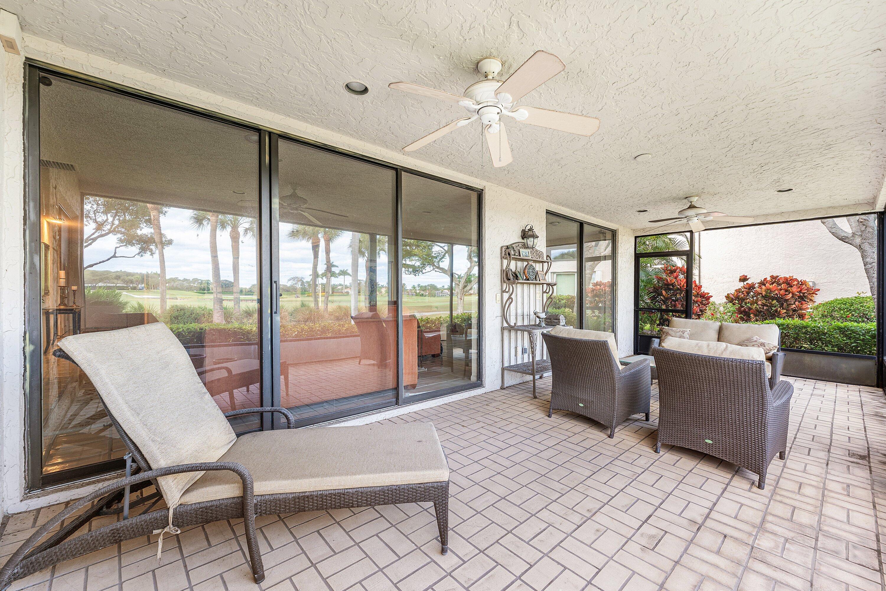 5 Eastgate Drive, Unit A Boynton Beach, FL 33436 - Photo 28 of 49 a living room with couch and a large window