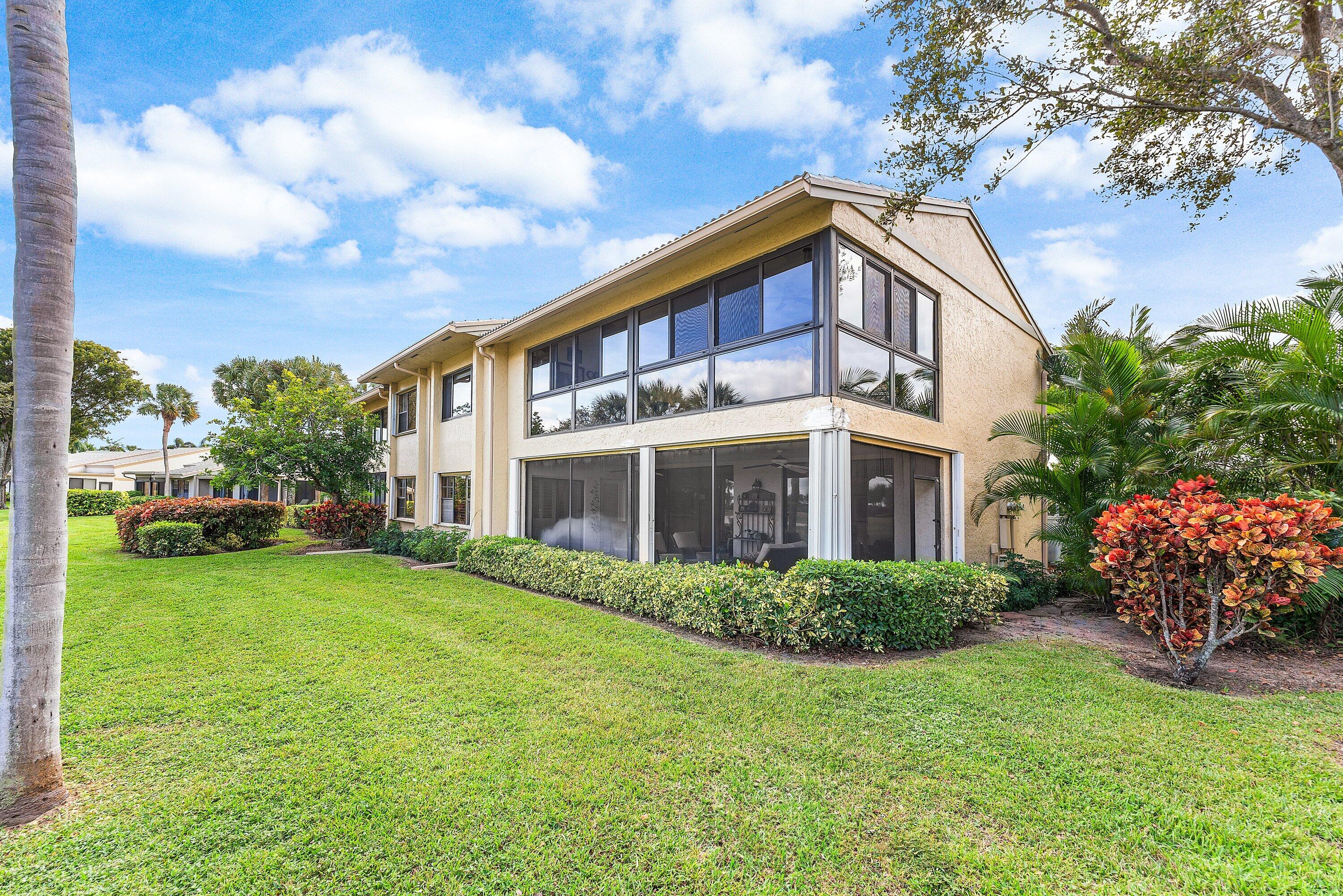 5 Eastgate Drive, Unit A Boynton Beach, FL 33436 - Photo 32 of 49 a front view of a house with garden