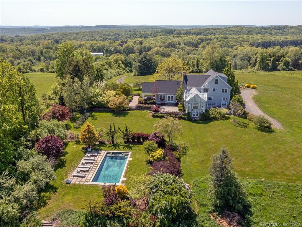 an aerial view of residential houses with outdoor space