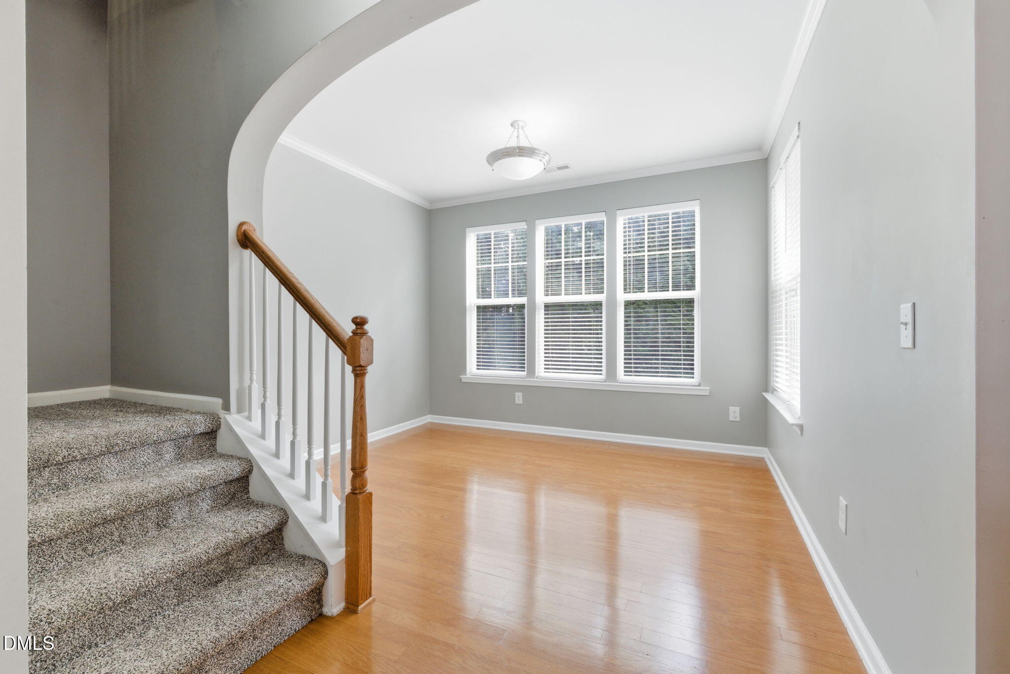 5003 Celtic Court Raleigh, NC 27612 - Photo 12 of 45 a view of an entryway with wooden floor and door