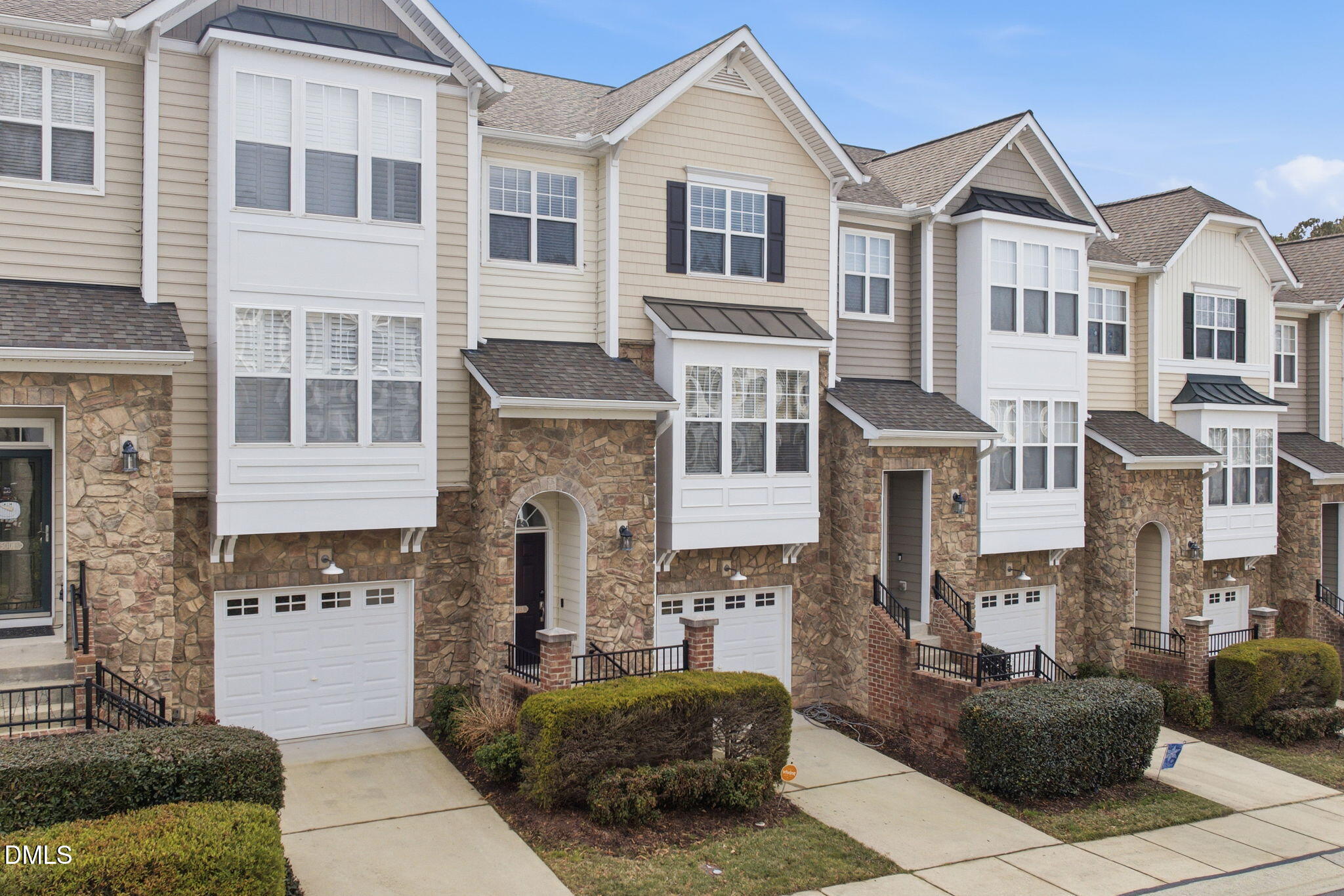 5003 Celtic Court Raleigh, NC 27612 - Photo 2 of 45 a front view of a house with a yard