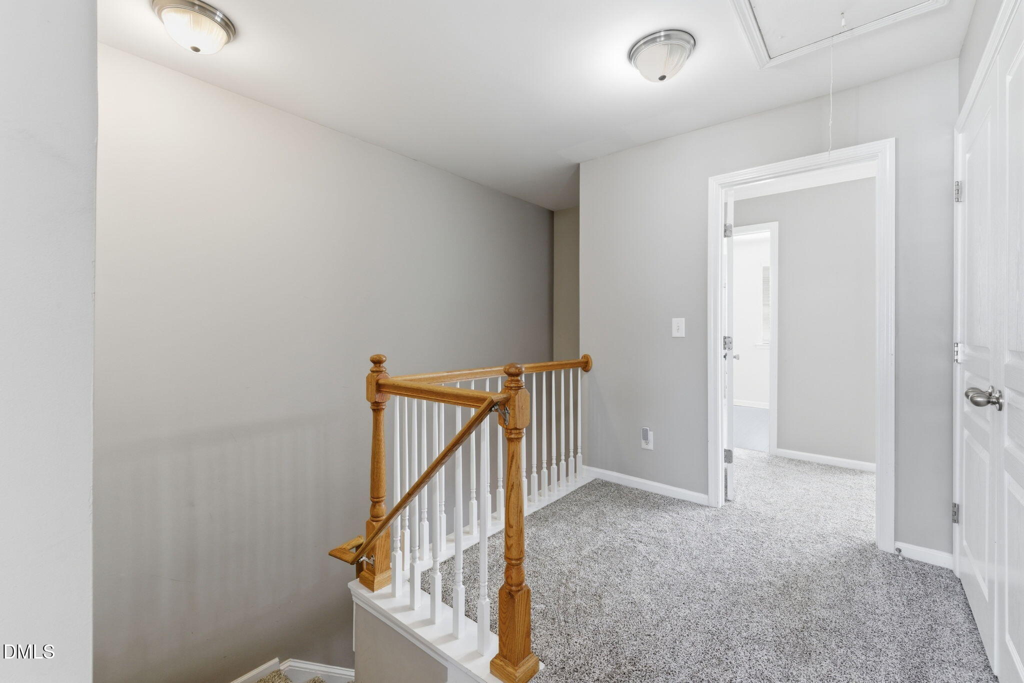 5003 Celtic Court Raleigh, NC 27612 - Photo 23 of 45 a view of staircase with railing and white walls