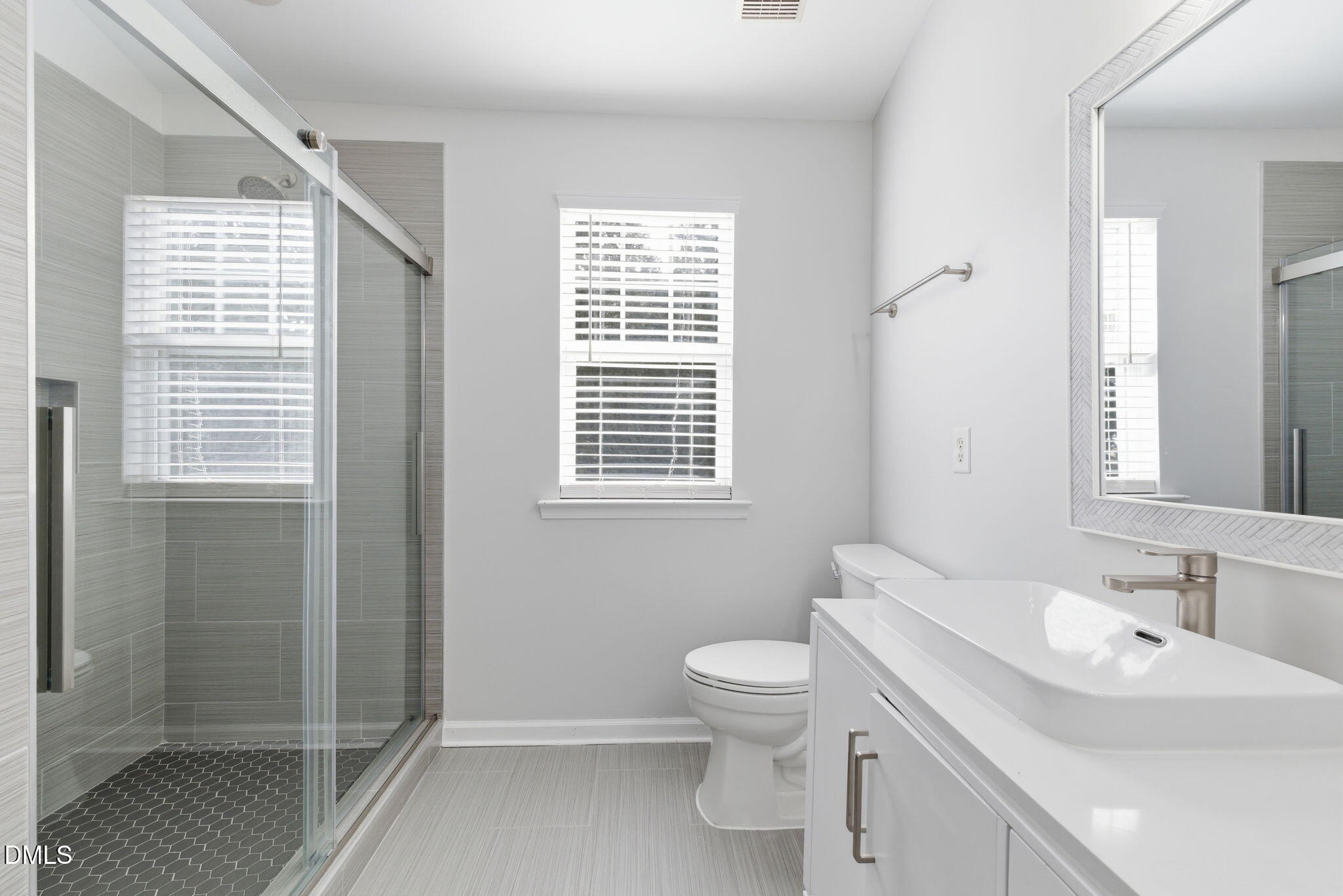 5003 Celtic Court Raleigh, NC 27612 - Photo 28 of 45 a bathroom with a sink toilet and shower