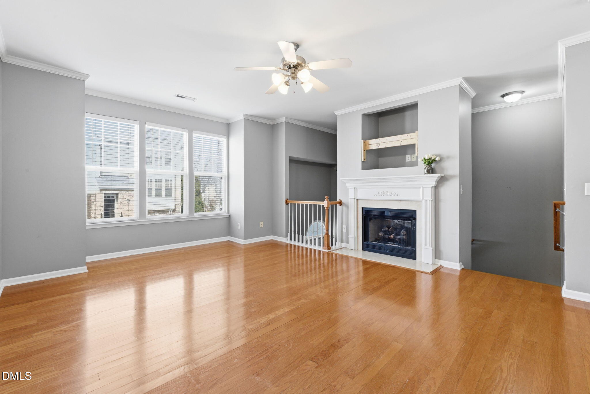 5003 Celtic Court Raleigh, NC 27612 - Photo 9 of 45 a view of an empty room with a window and fireplace