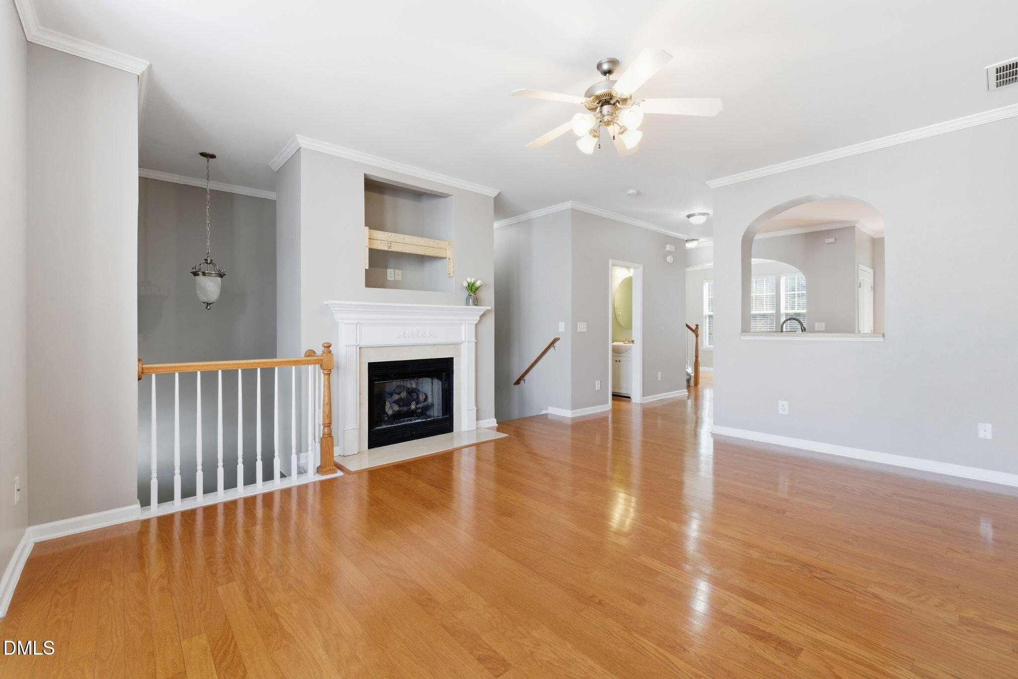 5003 Celtic Court Raleigh, NC 27612 - Photo 10 of 45 a view of an empty room with chandelier fan and fire place