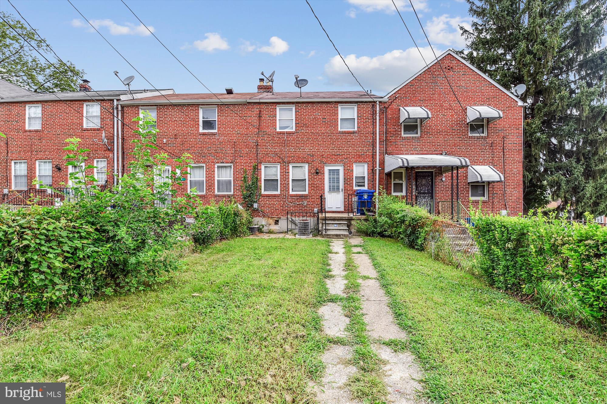 5755 Maplehill Road Baltimore, MD 21239 - Photo 18 of 18 a front view of a house with garden