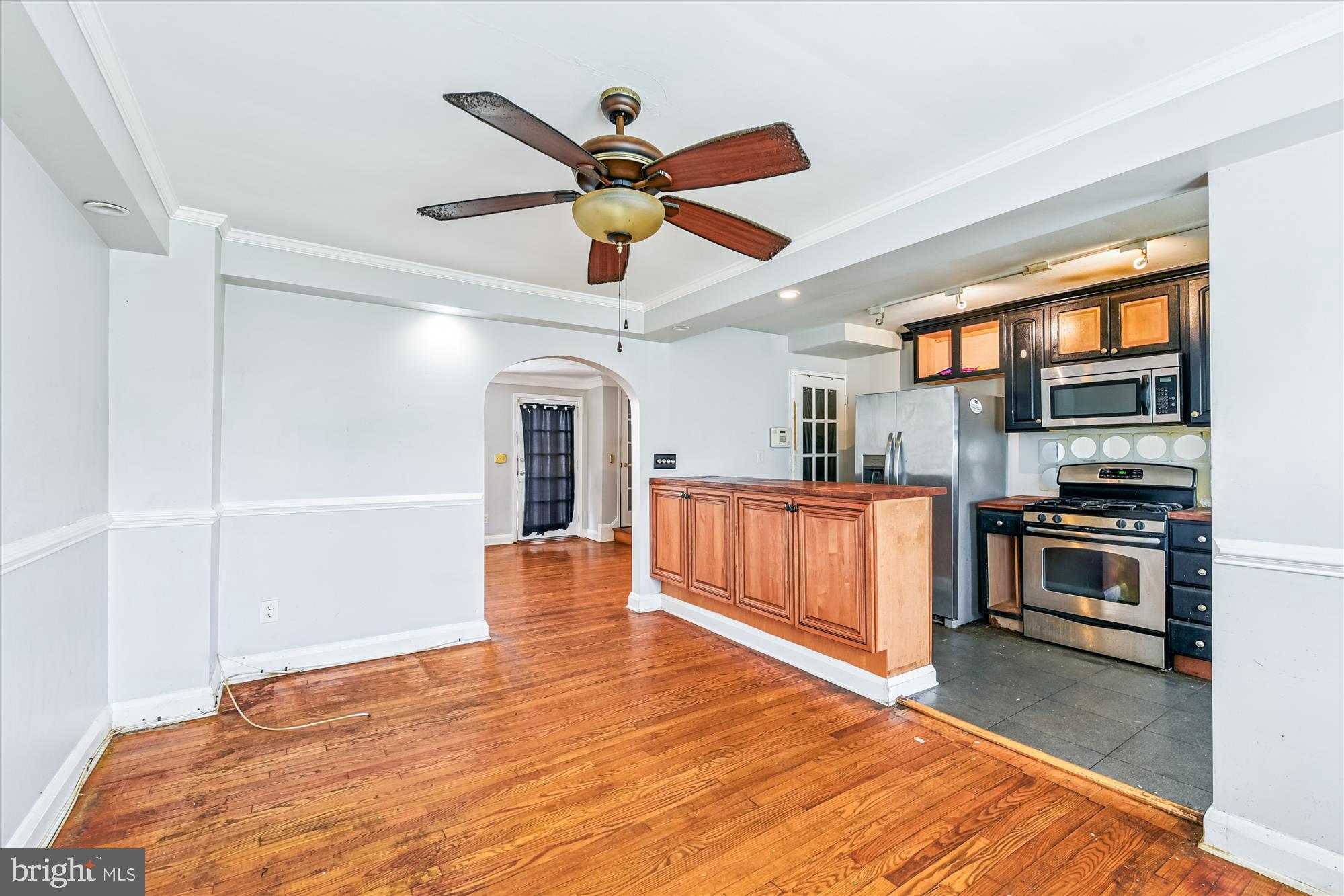 5755 Maplehill Road Baltimore, MD 21239 - Photo 6 of 18 a view of a kitchen with a sink and microwave