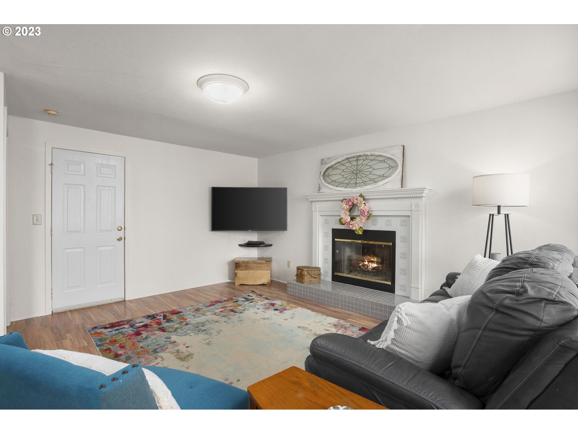 803 Southwest 4th Street Gresham, OR 97080 - Photo 16 of 42 a living room with furniture and a flat screen tv