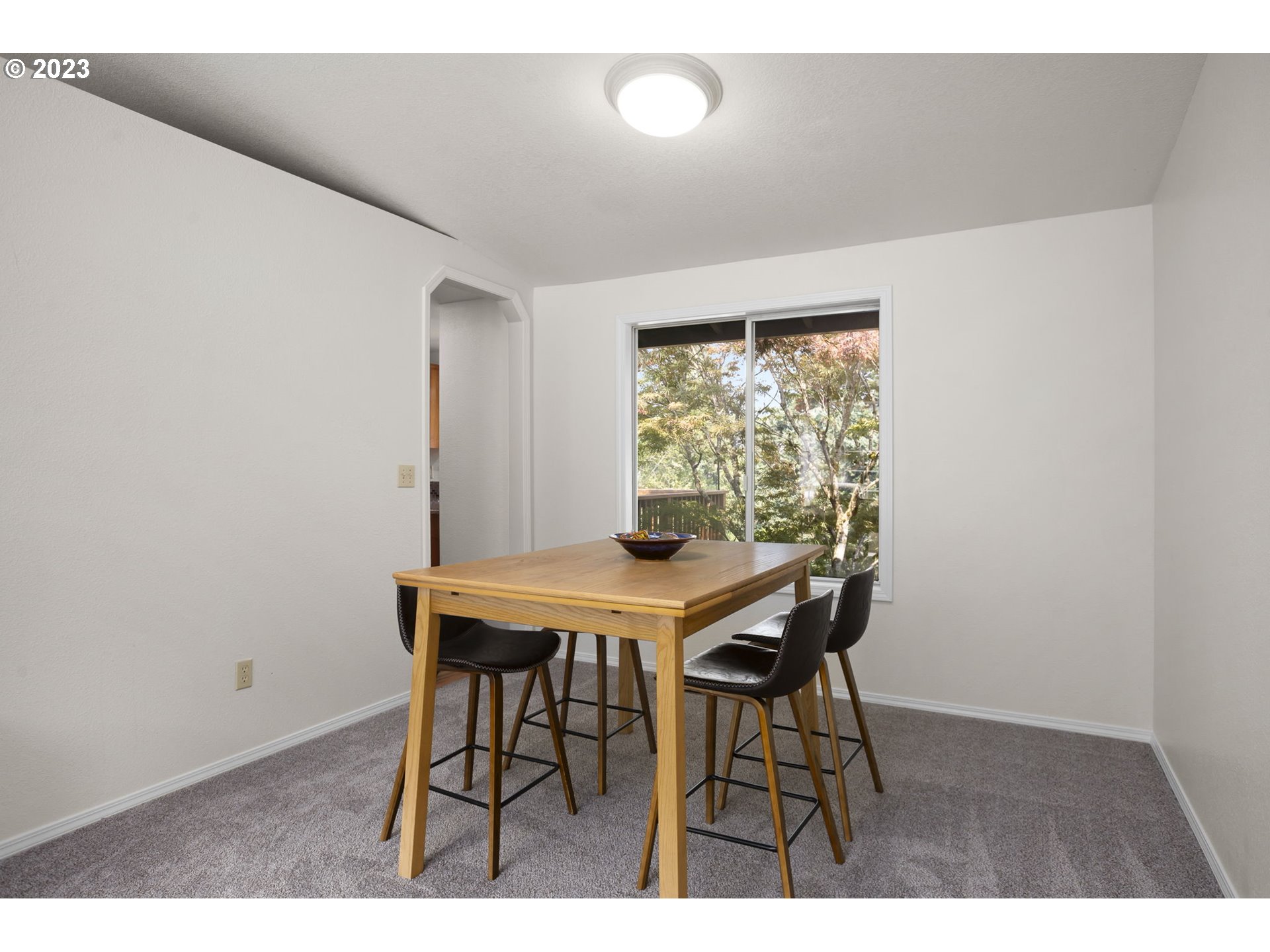 803 Southwest 4th Street Gresham, OR 97080 - Photo 17 of 42 a view of a dining room with furniture and wooden floor